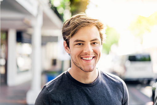 A smiling male Jupiter patient from Roy C. Blake III, DDS, MSD, Maxillofacial Prosthodontist.