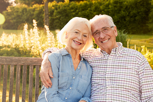 two smiling Jupiter patients from Roy C. Blake III, DDS, MSD, Maxillofacial Prosthodontist